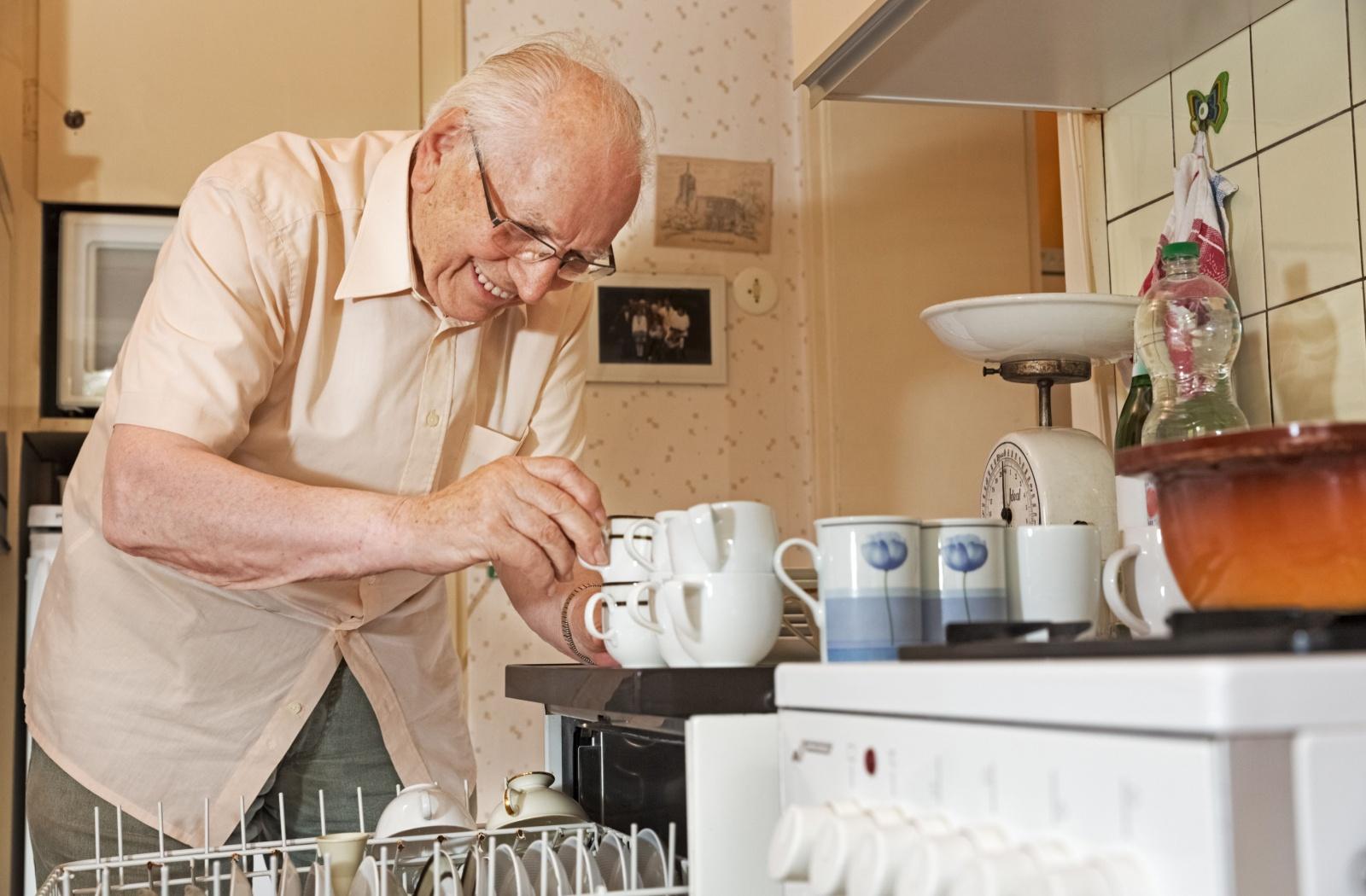 a senior stacks clean coffee cups